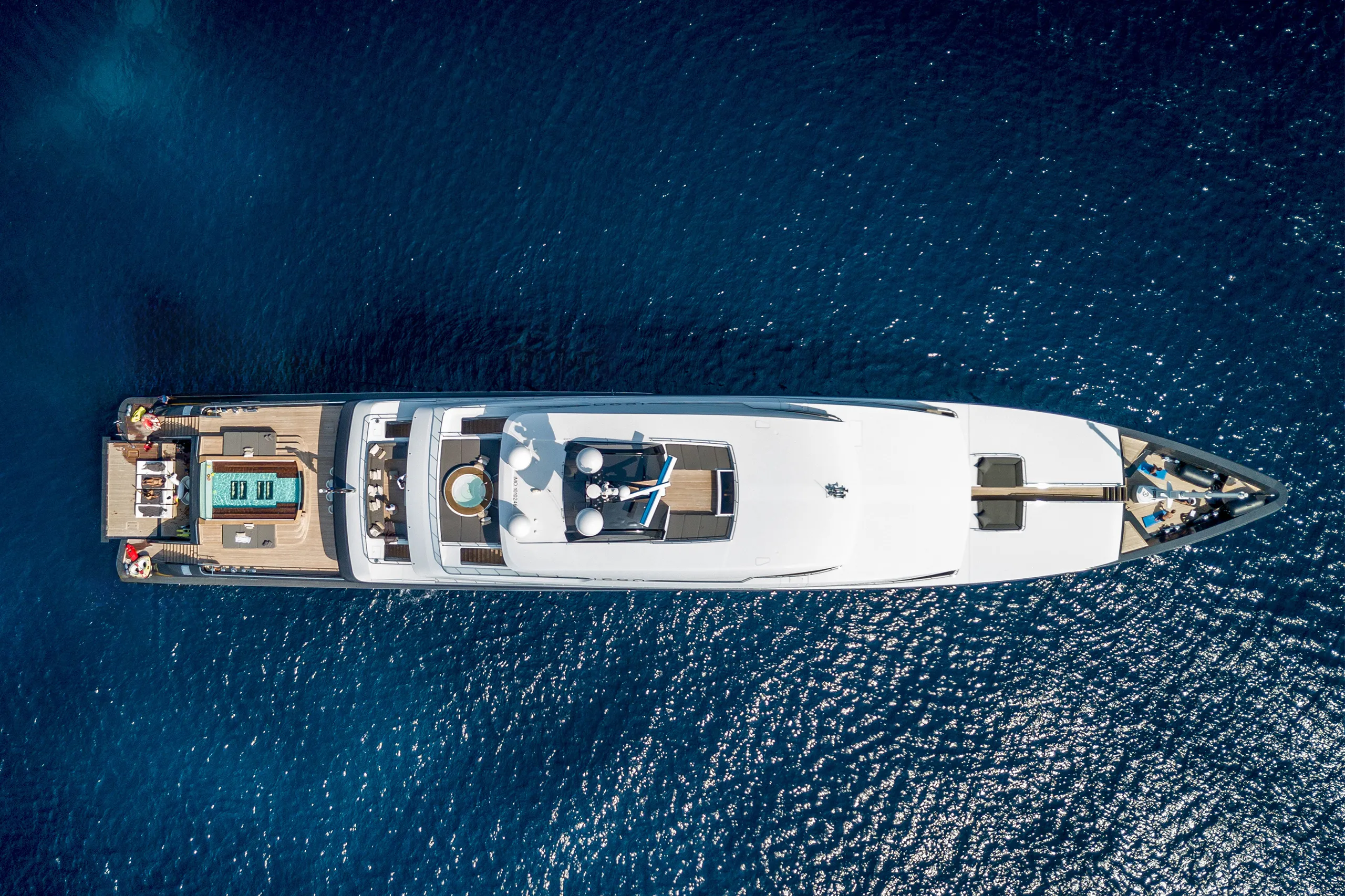 An overhead view of a luxury superyacht during a charter managed by Design Asset Management
