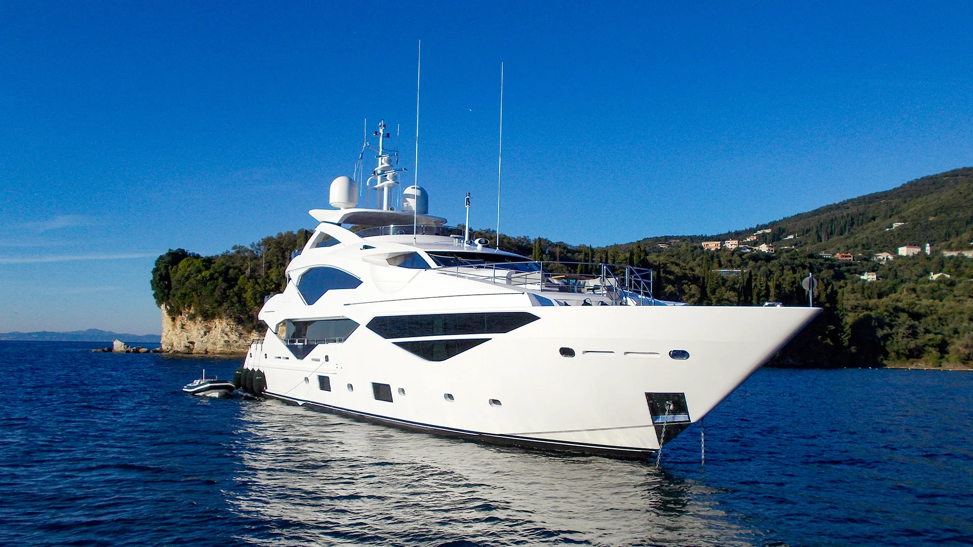 Superyacht anchored near the coastline in the Mediterranean