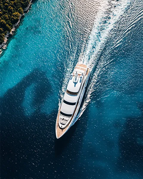 drone view of a superyacht cruising