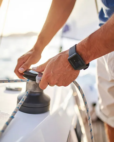 superyacht crew member with rope